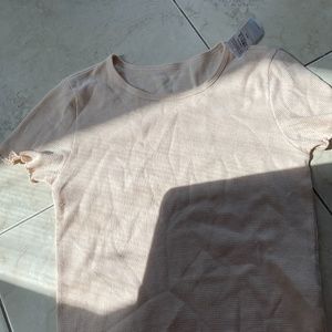 Brown American eagle shirt.